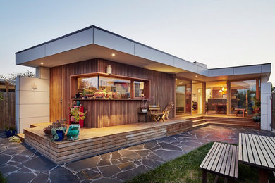Mid-sized danish backyard deck photo in Melbourne with a roof extension