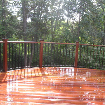 Elevated curved Ipe deck in Herndon, VA, with spiral staircase.