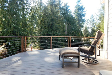 Inspiration for a rustic backyard deck remodel in Seattle with no cover