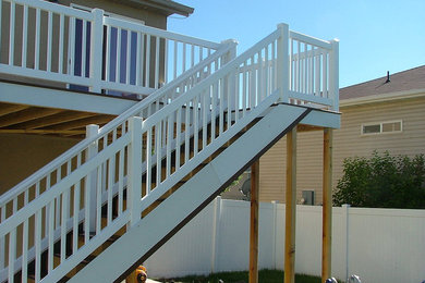 Inspiration for a small timeless backyard deck remodel in Salt Lake City with no cover