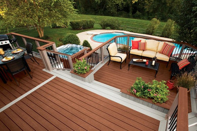 Example of a cottage backyard deck design in Boise with no cover