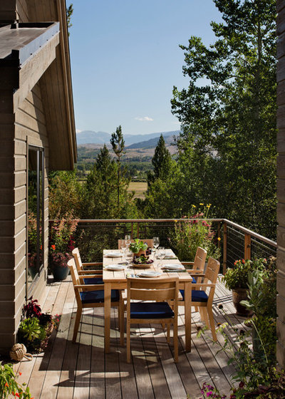 Rustic Deck by EK Reedy Interiors, Inc.