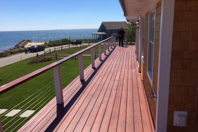 Deck - large traditional side yard deck idea in Boston with no cover