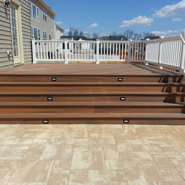 Fiberon deck with steps down to custom paver patio in Point of Rocks, MD