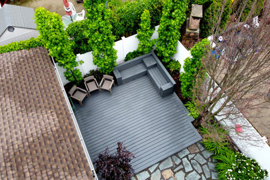 Inspiration for a small modern backyard deck remodel in New York