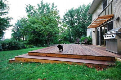 Deck - mid-sized contemporary backyard deck idea in Philadelphia with an awning
