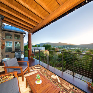 Inspiration for a craftsman deck remodel in San Diego with a roof extension
