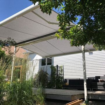 Free standing, dual-retracting awning