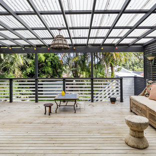 This is an example of a large mediterranean rooftop and rooftop deck in Sydney with an awning.