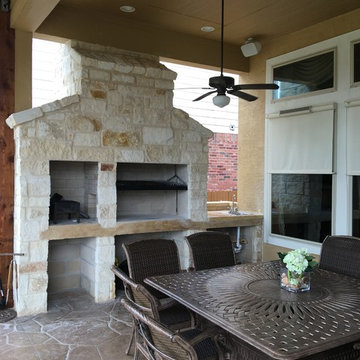 Gable Cover with Decorative Concrete Patio and Stone Grill/Fireplace
