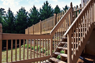 Deck - large backyard deck idea in St Louis with no cover