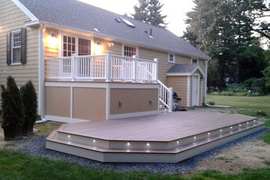 Example of a backyard deck design in Boston with no cover