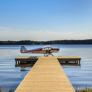Dock - farmhouse backyard dock idea in New Orleans with no cover