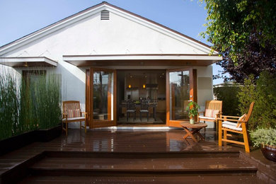 Inspiration for a large traditional back terrace in Los Angeles with a roof extension.