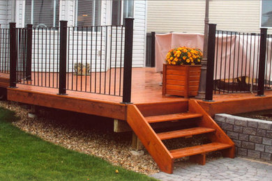 Inspiration for a mid-sized side yard deck remodel in Edmonton with a roof extension