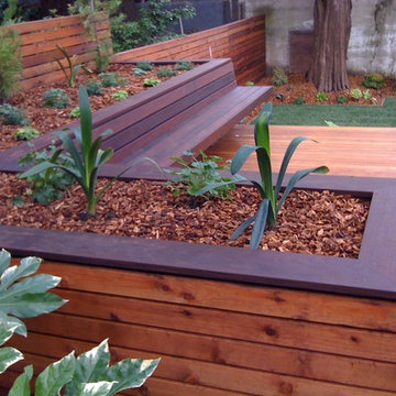 Hardwood deck with built-in bench and planters