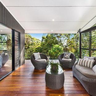 This is an example of a contemporary deck in Wollongong with a roof extension.