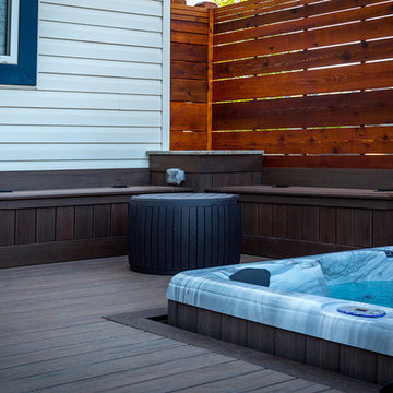 Hot tub area with cedar privacy screens and built in benches
