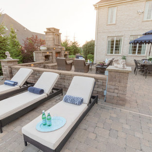 Deck - large mediterranean courtyard deck idea in Other with a fireplace and no cover