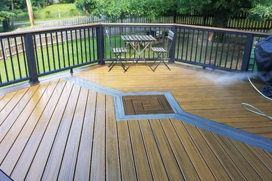 Inspiration for a mid-sized timeless backyard deck remodel in Other