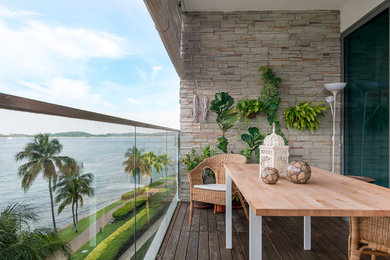 Design ideas for a world-inspired terrace in Singapore with a roof extension.