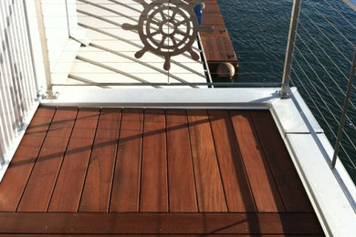 Inspiration for a coastal backyard deck remodel in Portland with no cover