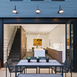 Inspiration for a mid-sized contemporary backyard deck container garden remodel in DC Metro with no cover