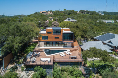 Inspiration for a large contemporary backyard deck remodel in Austin with no cover
