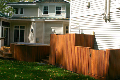 Inspiration for a huge contemporary backyard outdoor shower deck remodel in Boston