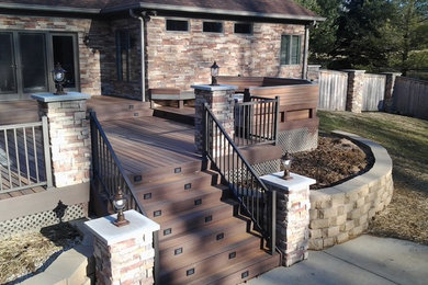 Example of a large arts and crafts backyard outdoor kitchen deck design in Indianapolis with no cover
