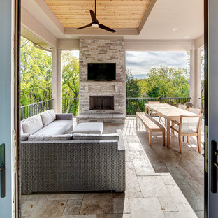 Deck - transitional backyard deck idea in Kansas City with a fireplace and a roof extension