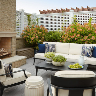 Inspiration for a mid-sized transitional rooftop deck remodel in Chicago with a fireplace and no cover