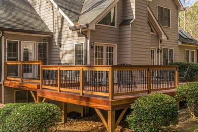 Example of a mid-sized transitional backyard deck container garden design in Atlanta with no cover
