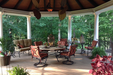 Deck - large traditional backyard deck idea in Other