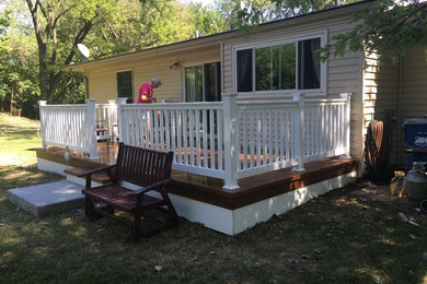 Example of a mid-sized classic backyard deck design in St Louis with no cover