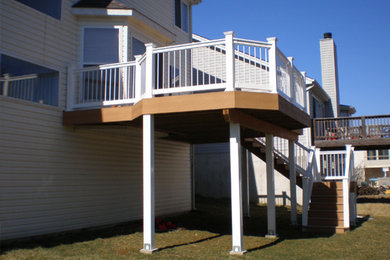 Inspiration for a large backyard deck remodel in St Louis