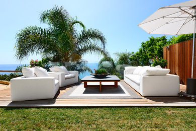 Inspiration for a large coastal backyard deck remodel in Los Angeles with no cover