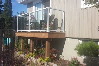 Deck - small contemporary backyard deck idea in Toronto with no cover