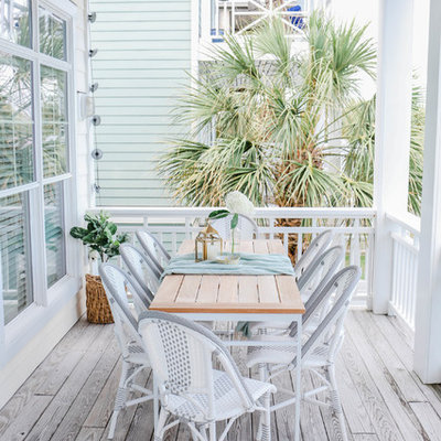 Inspiration for a mid-sized coastal deck remodel in Other with a roof extension