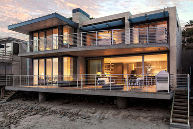 Deck - large modern backyard deck idea with no cover