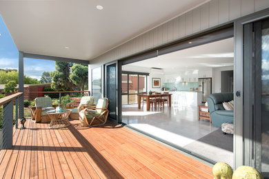 Inspiration for a modern back terrace in Melbourne with a roof extension.