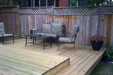 Inspiration for a mid-sized contemporary backyard deck remodel in Ottawa