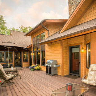 Large mountain style backyard deck photo in Other with no cover