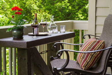 Inspiration for a small rustic rooftop deck remodel in Charlotte with a roof extension