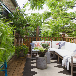 Example of an eclectic deck design in Chicago with no cover