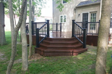 Example of a mid-sized classic backyard deck design in Indianapolis with no cover