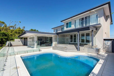 Photo of a medium sized modern back terrace in Newcastle - Maitland.