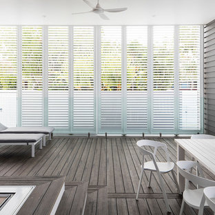 Inspiration for a beach style deck in Sunshine Coast with a roof extension.