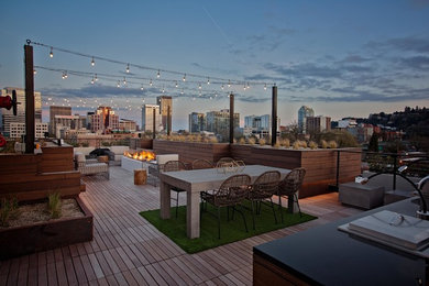 Trendy rooftop rooftop outdoor kitchen deck photo in Portland with no cover