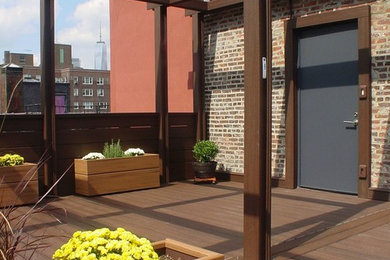 Deck - large transitional rooftop deck idea in New York with a pergola